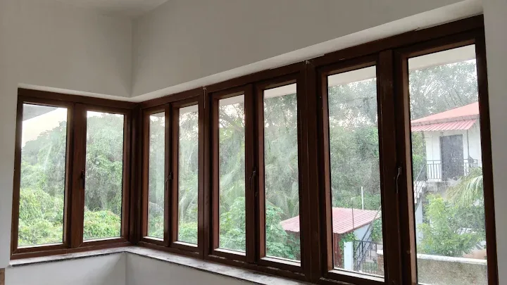 Wood-finish corner window installation