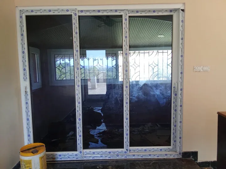 Large dark-glazed window installation