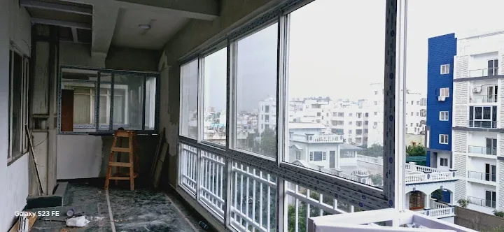 Wide UPVC windows along a residential balcony